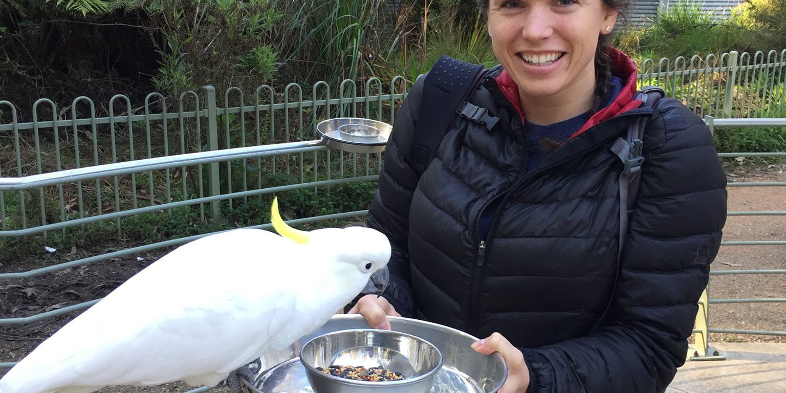 Rebecca Koch (right) and a cockatoo (left).