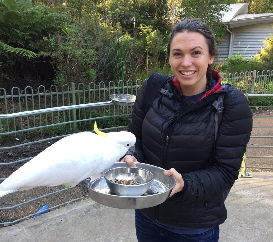 Rebecca Koch (right) and a cockatoo (left).