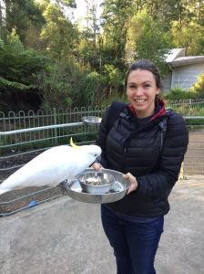 Rebecca Koch (right) and a cockatoo (left).
