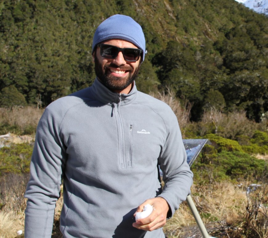 Diego hiking in New Zealand (holding a chunk of snow after seeing snow for the first time!)