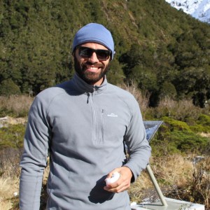Diego hiking in New Zealand (holding a chunk of snow after seeing snow for the first time!)