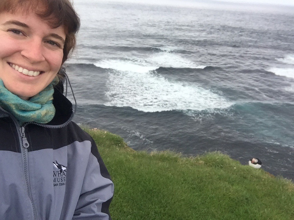 Dr Erin Sauer in Iceland (with puffin.)