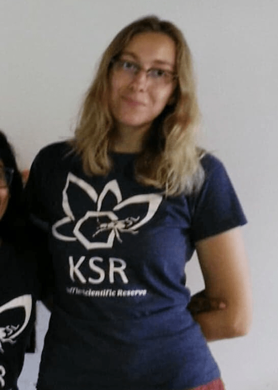 Julia Boyle wearing a t-shirt with the logo for her field station, the Koffler Scientific Reserve.