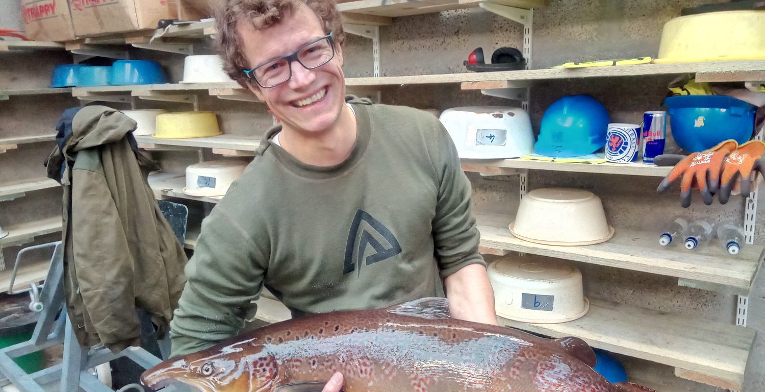 Libor Zàvorka with a male adult Atlantic salmon during milt and eggs collection.