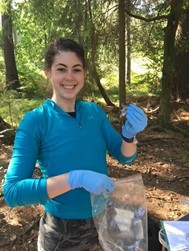 A photo of Amy carrying out wild wood mouse fieldwork.